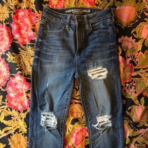 Medium wash, distressed high-rise jeggings. Size 2